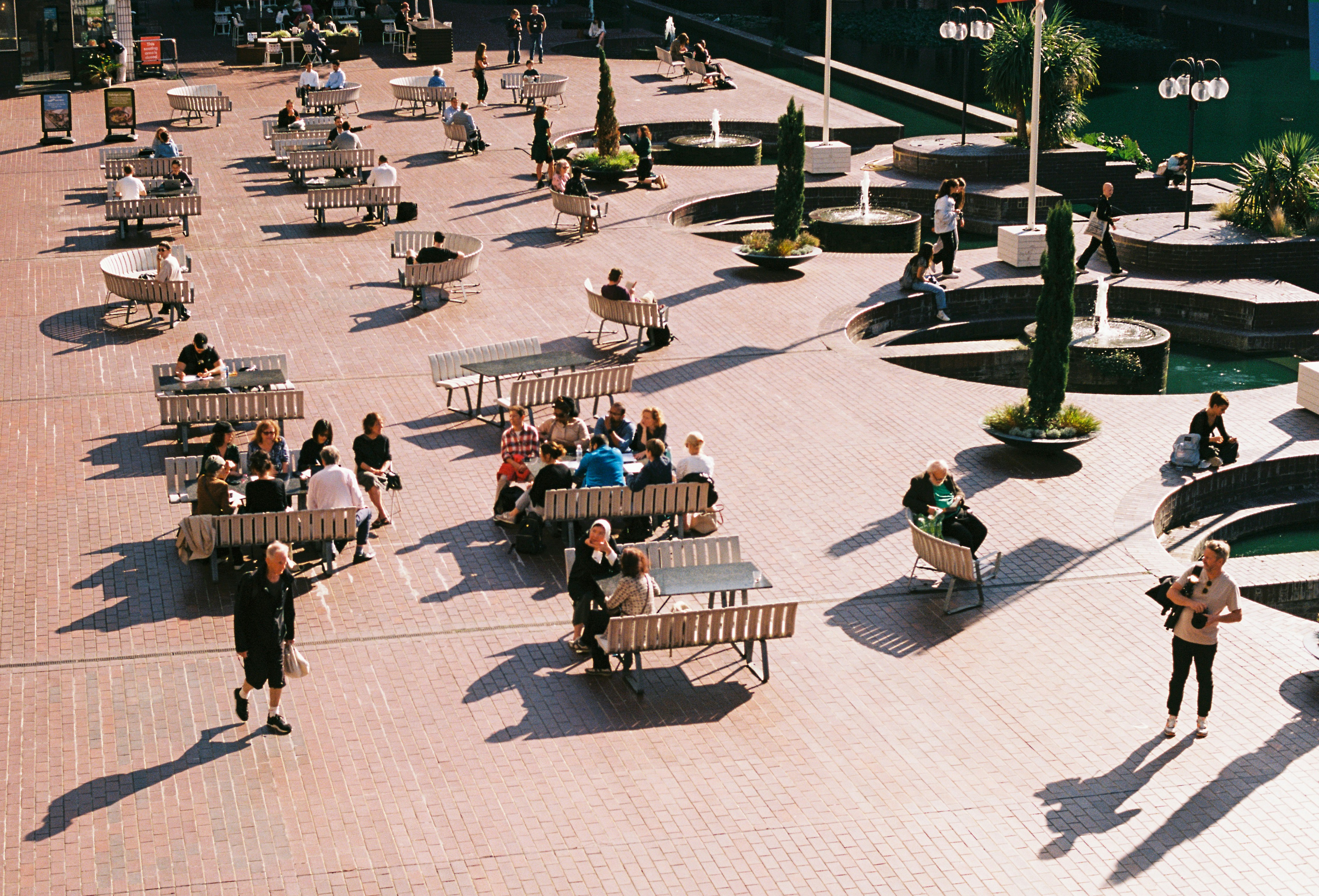 City square showing an aerial view of people sitting on benches